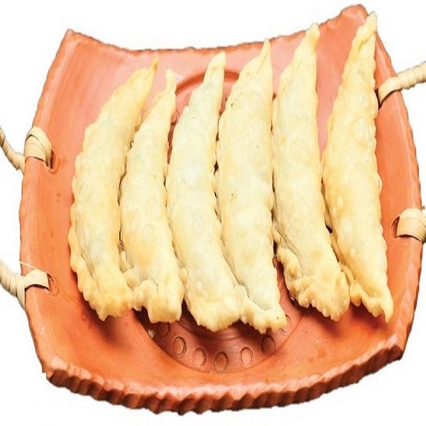 Til puli vapa pitha (তিল পুলি)