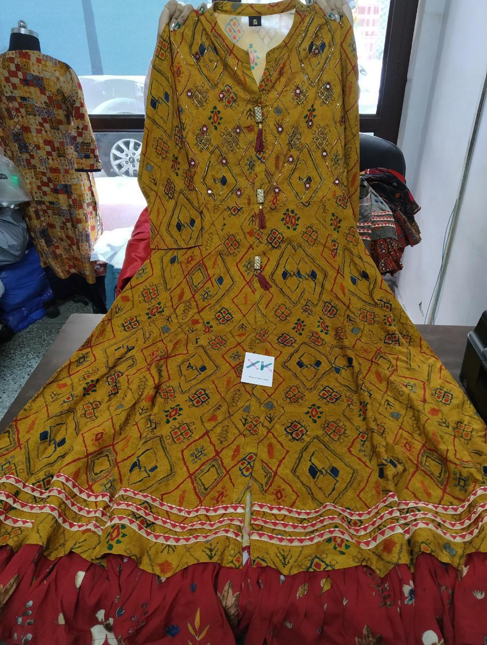 Heavy rayon digital print gown with embroidery and teasels.